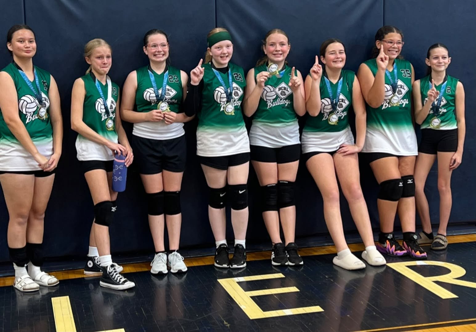 BCRL volleyball team with medals