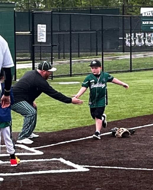 BCRL baseball player getting a high five