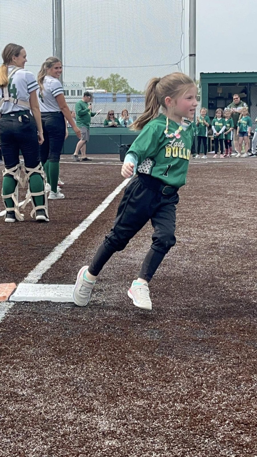 BCRL softball player running onto the field